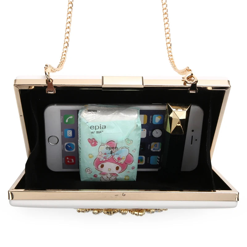 Detailed crystal embellishments on white clutch – luxury small handbag