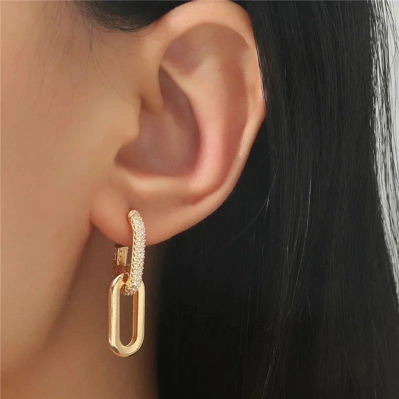 Woman wearing geometric rhinestone earrings at party – stylish accessory